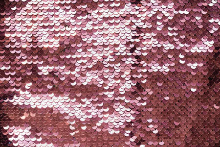 Luxury abstract  with coral iridescent sequins on fabric.の写真素材