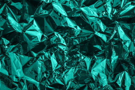 Mint green deformed cellophane or plastic. Creative background for your designの写真素材