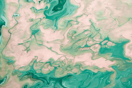 Free flowing beige and green acrylic paint. Abstract marble background or texture. Random Waves and...