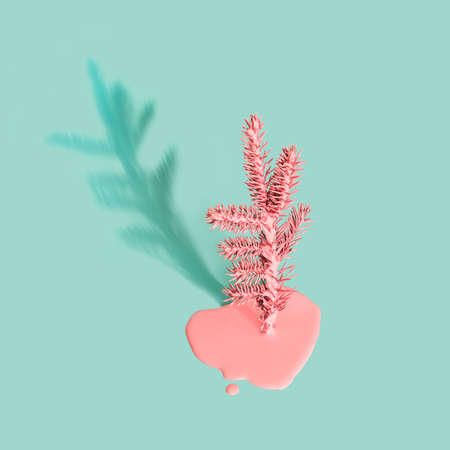 Painted Christmas tree with flowing paint on mint greenの写真素材