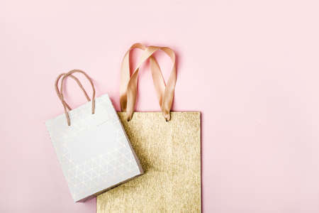 White and Gold Packages on pinkの写真素材