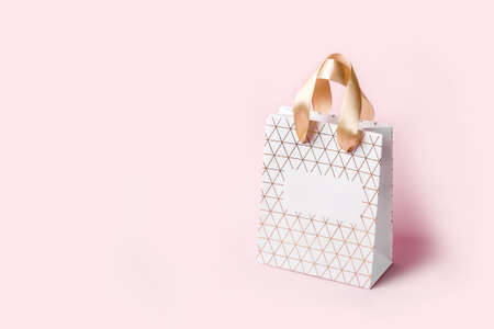 White Geometric shopping bag on pinkの写真素材