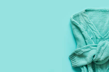 Mint Green Woolen pullover with braids. Monochrome Cozy Autumn Winter look, copy space.の写真素材