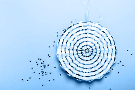 Paper striped decoration on blueの写真素材