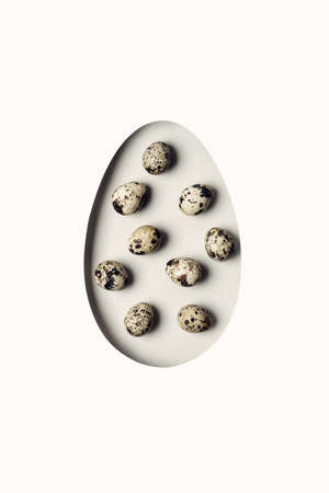 Creative layout with Egg shaped hole and quail eggs.