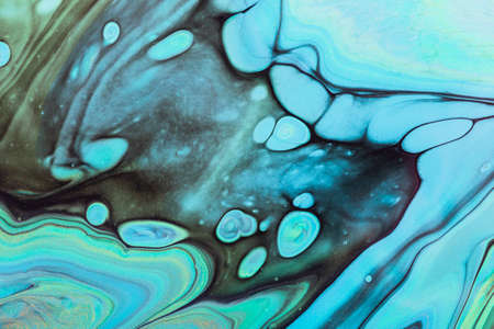 Fluid Art. Blue, green and black swirls. Abstract marble background or texture.