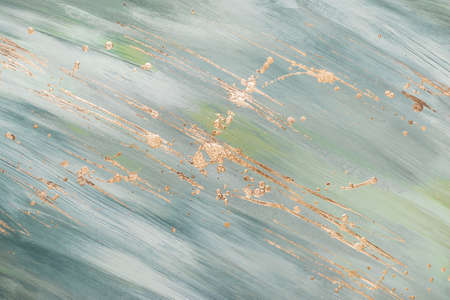 Monochrome greenish marble background with gold brushstrokes and drops. Place for your design