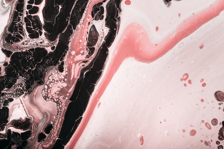 Fluid Art. Abstraction from black paint bubbles and pink coral waves. Marble effect background or...