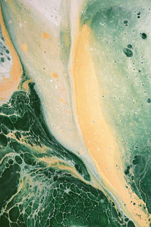 Acrylic Fluid Art. Natural green and yellow colors flow on canvas. Digital decor. Abstract stone background or textureの写真素材