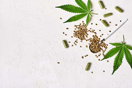 Cannabis medicine capsules, hemp green leaves and seedsの写真素材