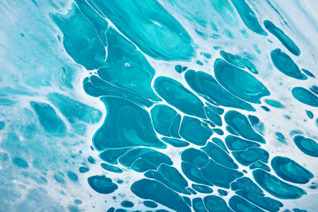 Acrylic Fluid Art. Turquoise spots on watercolor background. Abstract marble background or texture