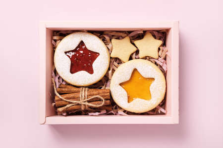 Eco Christmas Gift box with linzer cookies and cinnamon. Diy Sustainable present