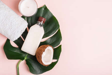 Coconut Oil or Cream, tropical leaves and coconut. Natural beauty spa product conceptの写真素材