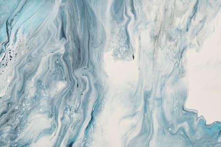 Fluid Art. Liquid white and blue abstract paint drips and wave. Marble effect background or texture