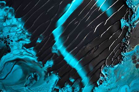 Fluid Art. Blue abstract wave swirls on black background. Marble effect background or textureの写真素材
