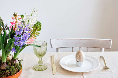 Easter table setting from hyacinths flowers and quail eggs on linen tablecloth. Zero Waste Easter
