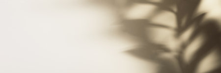 Natural leaves on branch shadow on beige paper banner. Abstract neutral floral backdrop. Soft light