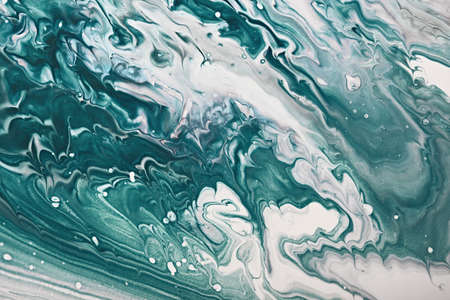 Fluid Art. Green abstract wave swirls. Marble effect background or texture