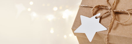 Banner with Christmas sustainable gift box with blank card. Christmas zero waste, boxing day and winter holidayの写真素材