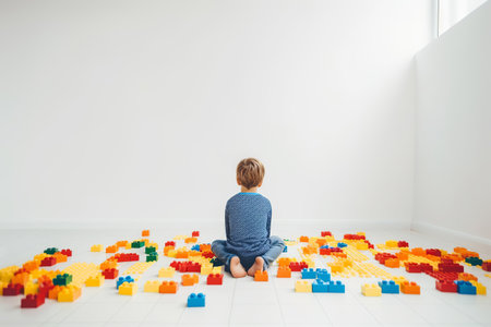 World Autism Awareness day. Faceless Child sitting alone in white room among colorful puzzles. Generative AI illustrationの素材
