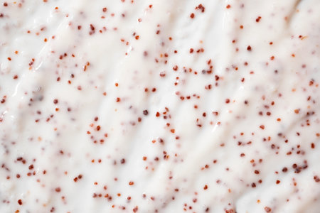 Texture of organic white scrub with Exfoliating coffee particles Close-up