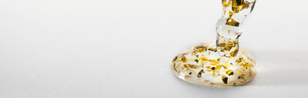 Banner with Pipette And drop of cosmetic product with gold particles, selective focus, copy spaceの写真素材