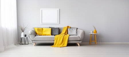 Modern Living Room with Gray Sofa and Yellow Accents and blank poster mockup on white wallの素材