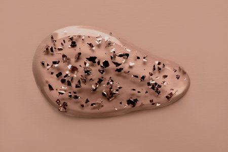 Transparent liquid gel swatch with particles in mocha mousse colorの写真素材