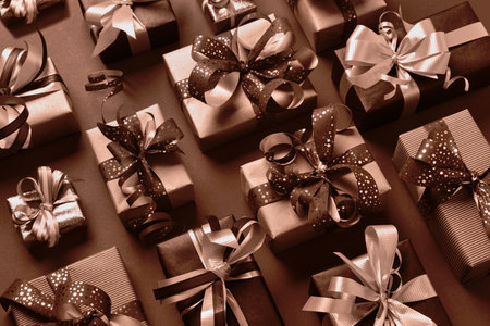 Festively wrapped gift boxes in mocha mousse color