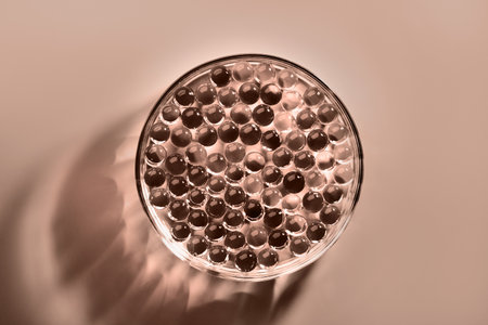 Sample of gel bubbles in petri dish in mocha mousse shadesの写真素材