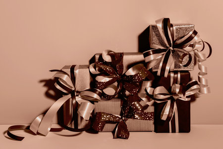 Gift boxes set in mocha mousse shades. Holiday Shopping conceptの写真素材