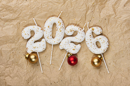 2026 candles and festive baubles creating a happy new year celebration concept