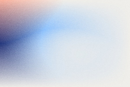 Abstract grainy gradient background in blue, white, and orange tones.