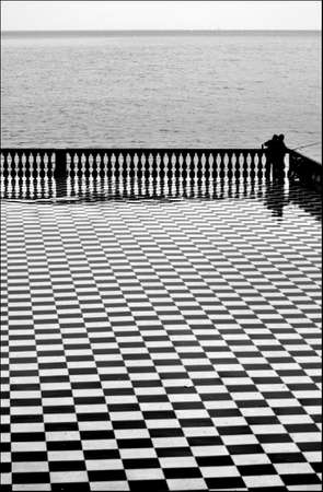 Livorno two fishermen on the Terrazza Mascagniの写真素材