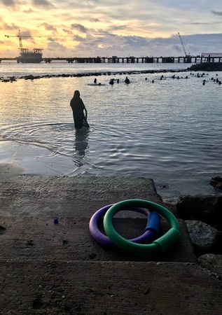 Maldives , some women working-out in water and on beach trying to live a healthier life