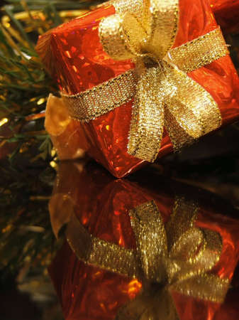 This is a reflection of a shiny, red Christmas present.の写真素材