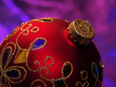 Round Christmas decoration with swirls of gold.の写真素材