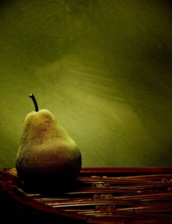 A pear in soft light on a crateの写真素材