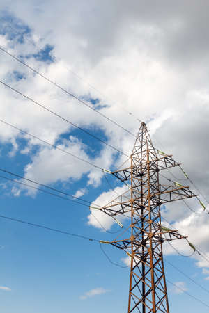 a high voltage power pylons against blue sky