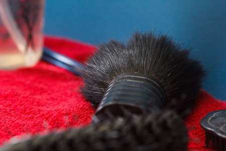 Hairdresser tools on black background with copy space in centerの写真素材