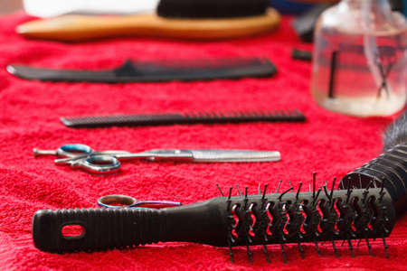 Hairdresser tools on black background with copy space in centerの写真素材