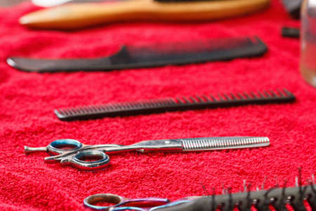 Hairdresser tools on black background with copy space in centerの写真素材
