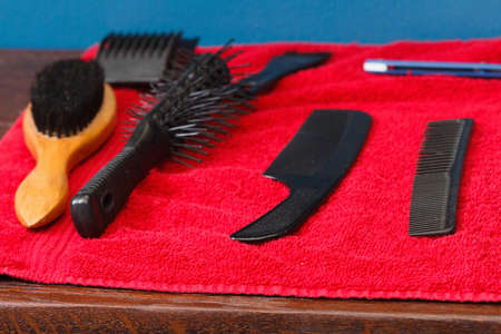 Tools for cutting hair and shaving on a red backgroundの写真素材