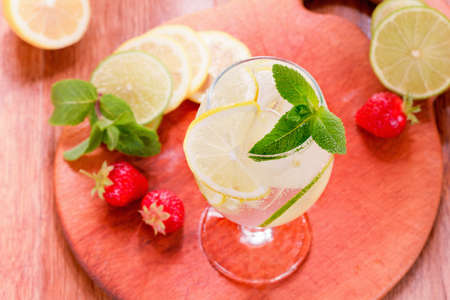 The cat takes the sausage in the refrigerator with his paw.の写真素材