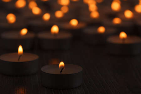 Candle background fire dark flame night reflection, burning.の写真素材