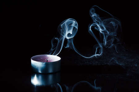 Candle smoke background black bright.candle smoke background black bright, fire.の写真素材