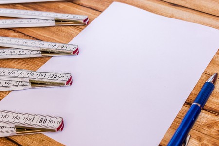 building level and ruler on wooden backgroundの写真素材