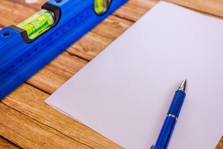 building level and ruler on wooden backgroundの写真素材