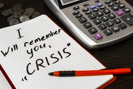 green sticker the Crisis lies on the Deskの写真素材