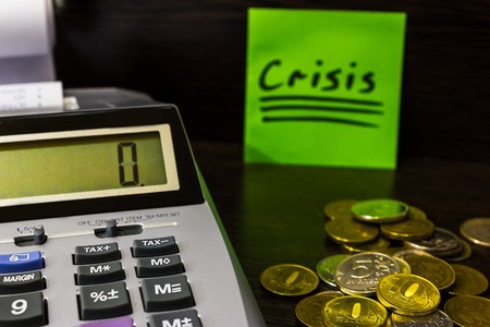 green sticker the Crisis lies on the Deskの写真素材